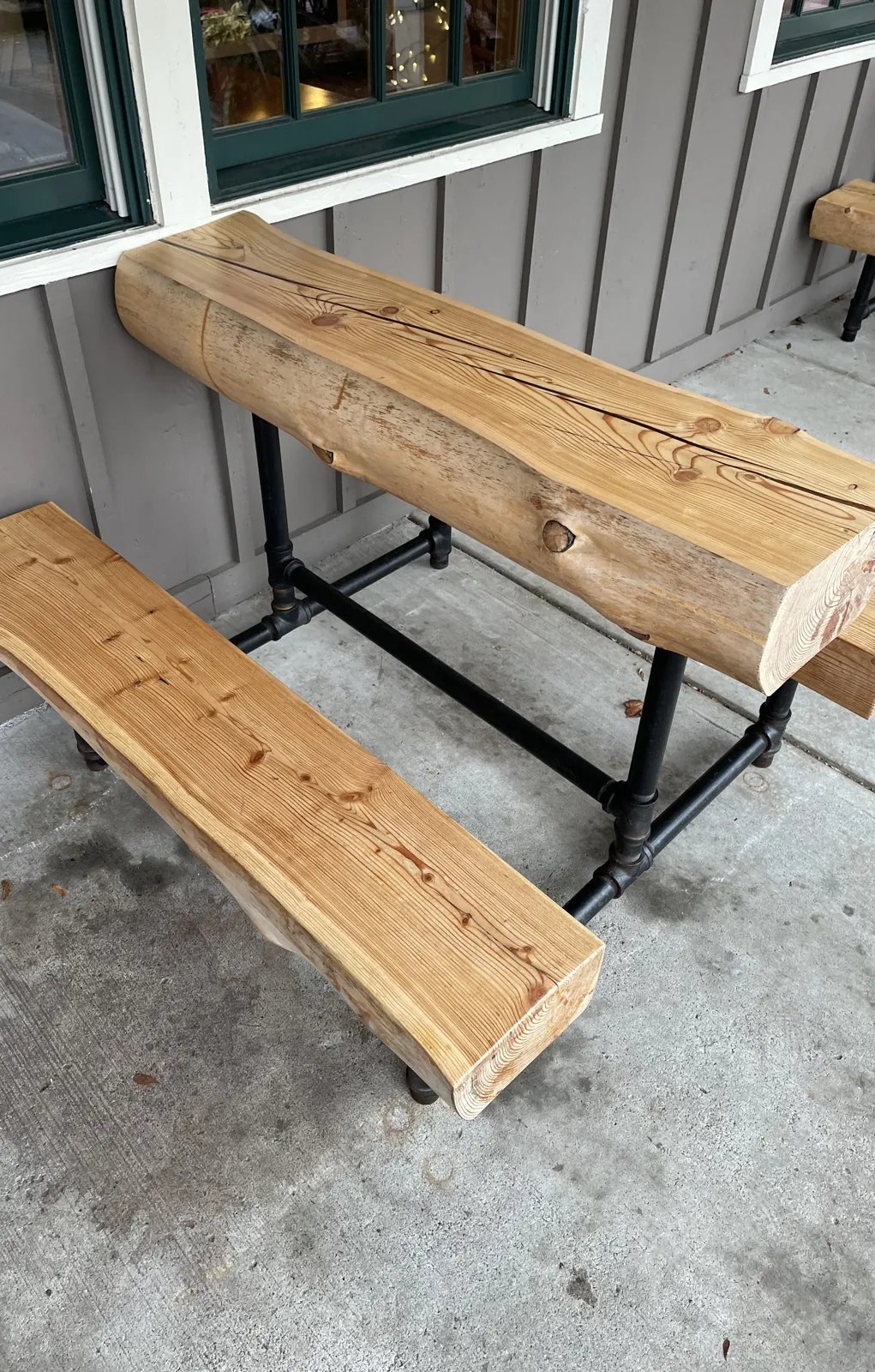 Restored table and bench reinstalled outdoors